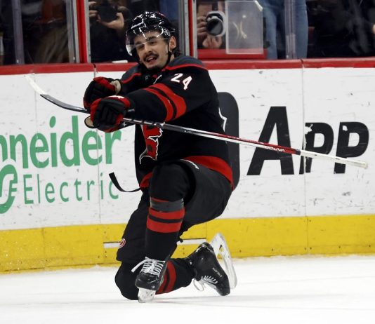 Carolina Hurricanes' Seth Jarvis (24) celebrates his game winning goal against the Boston Bruins during the third period of an NHL hockey game in Raleigh, N.C., Thursday, March 6, 2025. (AP Photo/Karl DeBlaker)