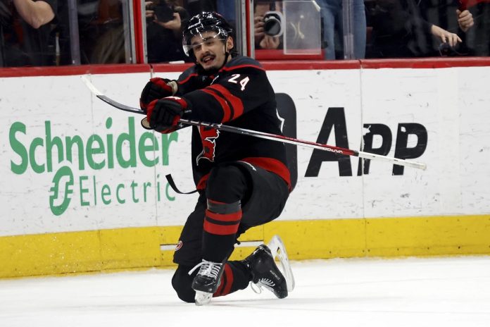 Carolina Hurricanes' Seth Jarvis (24) celebrates his game winning goal against the Boston Bruins during the third period of an NHL hockey game in Raleigh, N.C., Thursday, March 6, 2025. (AP Photo/Karl DeBlaker)