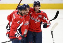 Washington Capitals left wing Alex Ovechkin (8) celebrates his goal with center Dylan Strome (17) and defenseman Martin Fehervary (42) during the third period of an NHL hockey game against the Tampa Bay Lightning, Saturday, March 1, 2025, in Washington. (AP Photo/Nick Wass)