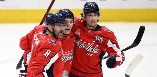 Washington Capitals left wing Alex Ovechkin (8) celebrates his goal with center Dylan Strome (17) and defenseman Martin Fehervary (42) during the third period of an NHL hockey game against the Tampa Bay Lightning, Saturday, March 1, 2025, in Washington. (AP Photo/Nick Wass)