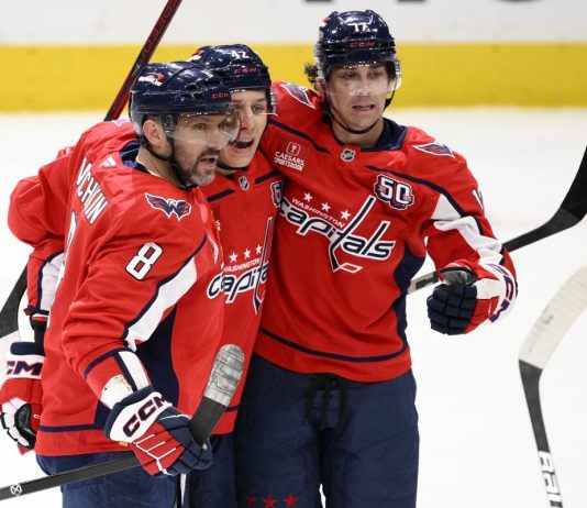 Washington Capitals left wing Alex Ovechkin (8) celebrates his goal with center Dylan Strome (17) and defenseman Martin Fehervary (42) during the third period of an NHL hockey game against the Tampa Bay Lightning, Saturday, March 1, 2025, in Washington. (AP Photo/Nick Wass)