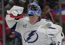 Tampa Bay Lightning goaltender Andrei Vasilevskiy spray water on on his face during the second period of an NHL hockey game against the Florida Panthers Monday, March 3, 2025, in Sunrise, Fla. (AP Photo/Lynne Sladky)