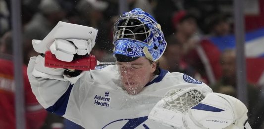 Tampa Bay Lightning goaltender Andrei Vasilevskiy spray water on on his face during the second period of an NHL hockey game against the Florida Panthers Monday, March 3, 2025, in Sunrise, Fla. (AP Photo/Lynne Sladky)