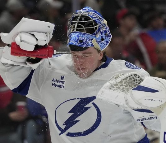 Tampa Bay Lightning goaltender Andrei Vasilevskiy spray water on on his face during the second period of an NHL hockey game against the Florida Panthers Monday, March 3, 2025, in Sunrise, Fla. (AP Photo/Lynne Sladky)