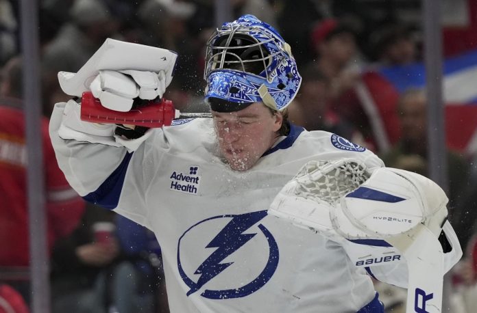 Tampa Bay Lightning goaltender Andrei Vasilevskiy spray water on on his face during the second period of an NHL hockey game against the Florida Panthers Monday, March 3, 2025, in Sunrise, Fla. (AP Photo/Lynne Sladky)