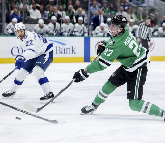 Dallas Stars left wing Mason Marchment (27) shoots during an NHL hockey game against the Tampa Bay Lightning in Dallas, Thursday, March 20, 2025. (AP Photo/Gareth Patterson)
