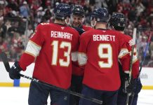 Florida Panthers center Aleksander Barkov (16) is congratulated after scoring a goal during the second period of an NHL hockey game against the Tampa Bay Lightning Monday, March 3, 2025, in Sunrise, Fla. (AP Photo/Lynne Sladky)