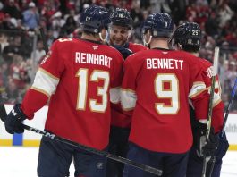 Florida Panthers center Aleksander Barkov (16) is congratulated after scoring a goal during the second period of an NHL hockey game against the Tampa Bay Lightning Monday, March 3, 2025, in Sunrise, Fla. (AP Photo/Lynne Sladky)