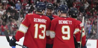 Florida Panthers center Aleksander Barkov (16) is congratulated after scoring a goal during the second period of an NHL hockey game against the Tampa Bay Lightning Monday, March 3, 2025, in Sunrise, Fla. (AP Photo/Lynne Sladky)