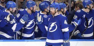 Tampa Bay Lightning defenseman Nick Perbix (48) celebrates with the bench after his goal against the Toronto Maple Leafs during the first period of an NHL hockey game Wednesday, April 9, 2025, in Tampa, Fla. (AP Photo/Chris O'Meara)