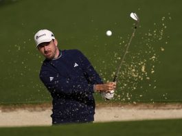 Nick Taylor, of Canada, hits from the bunker on the second hole during the second round at the Masters golf tournament, Friday, April 11, 2025, in Augusta, Ga. (AP Photo/Ashley Landis)