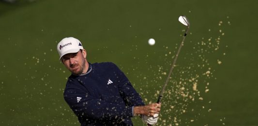 Nick Taylor, of Canada, hits from the bunker on the second hole during the second round at the Masters golf tournament, Friday, April 11, 2025, in Augusta, Ga. (AP Photo/Ashley Landis)