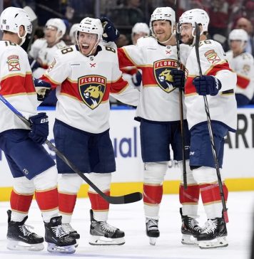 Florida Panthers defenseman Nate Schmidt (88) celebrates his goal against the Tampa Bay Lightning with center Aleksander Barkov (16), Sam Reinhart (13) and Uvis Balinskis (26) during the first period in Game 2 of an NHL hockey Stanley Cup first-round playoff series, Thursday, April 24, 2025, in Tampa, Fla. (AP Photo/Chris O'Meara)