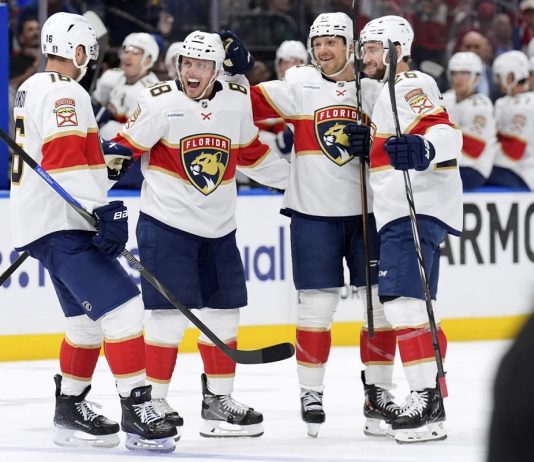 Florida Panthers defenseman Nate Schmidt (88) celebrates his goal against the Tampa Bay Lightning with center Aleksander Barkov (16), Sam Reinhart (13) and Uvis Balinskis (26) during the first period in Game 2 of an NHL hockey Stanley Cup first-round playoff series, Thursday, April 24, 2025, in Tampa, Fla. (AP Photo/Chris O'Meara)