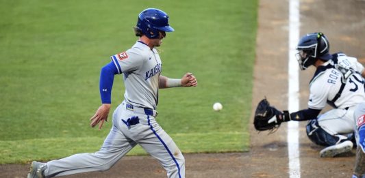 Kansas City Royals' Drew Waters scores ahead of the throw to Tampa Bay Rays catcher Ben Rortvedt (30) on a sacrifice,fly by Kyle Isbel during the second inning of a baseball game Tuesday, April 29, 2025, in Tampa, Fla. (AP Photo/Chris O'Meara)