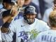Tampa Bay Rays' Chandler Simpson is congratulated after scoring during the ninth inning of a baseball game against the New York Yankees, Saturday, April 19, 2025, in Tampa, Fla. (AP Photo/Mike Carlson)