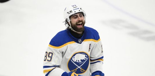 Buffalo Sabres right wing Alex Tuch celebrates after his goal during the third period of an NHL hockey game against the Washington Capitals, Sunday, March 30, 2025, in Washington. (AP Photo/Nick Wass)