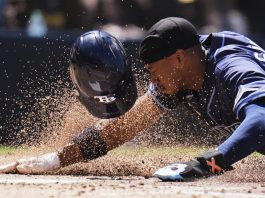 Tampa Bay Rays' Chandler Simpson slides in to score from third base off a wild pitch during the fifth inning of a baseball game against the San Diego Padres Sunday, April 27, 2025, in San Diego. (AP Photo/Gregory Bull)