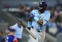 Tampa Bay Rays' Junior Caminero (13) celebrates his grand slam against the Toronto Blue Jays during ninth inning MLB baseball action in Toronto on Tuesday, May 13, 2025. (Nathan Denette/The Canadian Press via AP)
