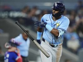 Tampa Bay Rays' Junior Caminero (13) celebrates his grand slam against the Toronto Blue Jays during ninth inning MLB baseball action in Toronto on Tuesday, May 13, 2025. (Nathan Denette/The Canadian Press via AP)