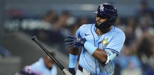 Tampa Bay Rays' Junior Caminero (13) celebrates his grand slam against the Toronto Blue Jays during ninth inning MLB baseball action in Toronto on Tuesday, May 13, 2025. (Nathan Denette/The Canadian Press via AP)