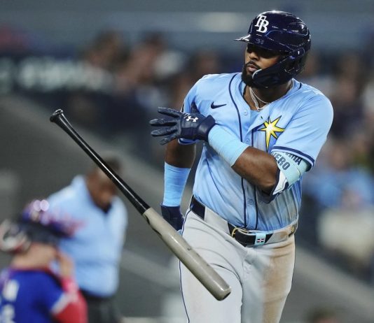 Tampa Bay Rays' Junior Caminero (13) celebrates his grand slam against the Toronto Blue Jays during ninth inning MLB baseball action in Toronto on Tuesday, May 13, 2025. (Nathan Denette/The Canadian Press via AP)