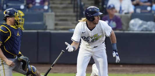 Tampa Bay Rays' Travis Jankowski, right, watches his RBI single off Milwaukee Brewers pitcher Trevor Megill during the ninth inning of a baseball game Saturday, May 10, 2025, in Tampa, Fla. (AP Photo/Chris O'Meara)
