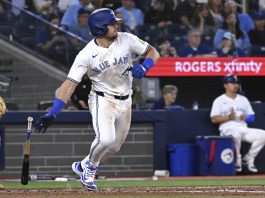 Toronto Blue Jays third baseman Addison Barger runs out a single against the Tampa Bay Rays in fifth inning baseball action in Toronto on Wednesday, May 14, 2025. (Jon Blacker/The Canadian Press via AP)