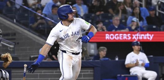 Toronto Blue Jays third baseman Addison Barger runs out a single against the Tampa Bay Rays in fifth inning baseball action in Toronto on Wednesday, May 14, 2025. (Jon Blacker/The Canadian Press via AP)