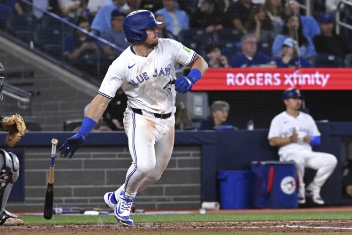 Jays defeat Rays 3-1 Toronto Blue Jays third baseman Addison Barger runs out a single against the Tampa Bay Rays in fifth inning baseball action in Toronto on Wednesday, May 14, 2025. (Jon Blacker/The Canadian Press via AP)