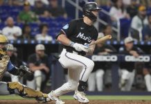 Miami Marlins' Kyle Stowers hits a single to center field during the sixth inning of a baseball game against the Tampa Bay Rays, Friday, May 16, 2025, in Miami. (AP Photo/Marta Lavandier)