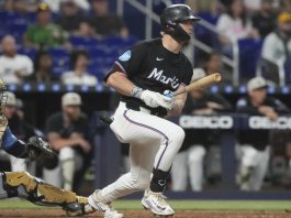Miami Marlins' Kyle Stowers hits a single to center field during the sixth inning of a baseball game against the Tampa Bay Rays, Friday, May 16, 2025, in Miami. (AP Photo/Marta Lavandier)