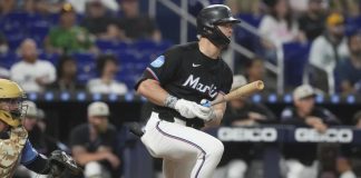 Miami Marlins' Kyle Stowers hits a single to center field during the sixth inning of a baseball game against the Tampa Bay Rays, Friday, May 16, 2025, in Miami. (AP Photo/Marta Lavandier)