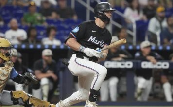 Miami Marlins' Kyle Stowers hits a single to center field during the sixth inning of a baseball game against the Tampa Bay Rays, Friday, May 16, 2025, in Miami. (AP Photo/Marta Lavandier)