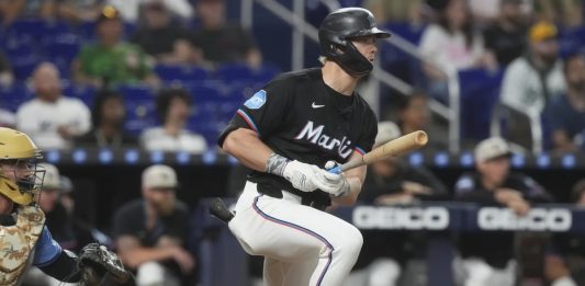 Miami Marlins' Kyle Stowers hits a single to center field during the sixth inning of a baseball game against the Tampa Bay Rays, Friday, May 16, 2025, in Miami. (AP Photo/Marta Lavandier)