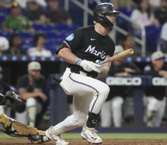 Miami Marlins' Kyle Stowers hits a single to center field during the sixth inning of a baseball game against the Tampa Bay Rays, Friday, May 16, 2025, in Miami. (AP Photo/Marta Lavandier)