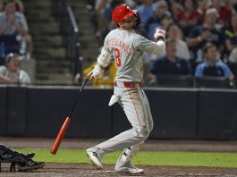 Philadelphia Phillies' Nick Castellanos (8) watches his three-run home run off Tampa Bay Rays pitcher Mason Englert during the eighth inning of a baseball game Tuesday, May 6, 2025, in Tampa, Fla. (AP Photo/Chris O'Meara)