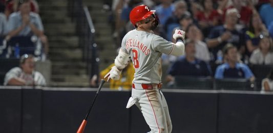 Philadelphia Phillies' Nick Castellanos (8) watches his three-run home run off Tampa Bay Rays pitcher Mason Englert during the eighth inning of a baseball game Tuesday, May 6, 2025, in Tampa, Fla. (AP Photo/Chris O'Meara)