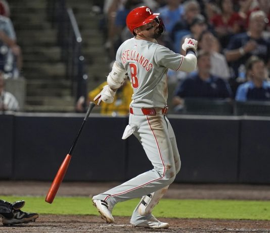 Philadelphia Phillies' Nick Castellanos (8) watches his three-run home run off Tampa Bay Rays pitcher Mason Englert during the eighth inning of a baseball game Tuesday, May 6, 2025, in Tampa, Fla. (AP Photo/Chris O'Meara)
