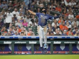 Tampa Bay Rays' Junior Caminero (13) celebrates his three-run home run against Houston Astros relief pitcher Bryan King during the seventh inning of a baseball game, Thursday, May 29, 2025, in Houston. (AP Photo/Karen Warren)
