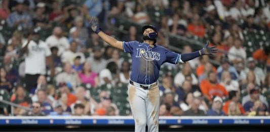 Tampa Bay Rays' Junior Caminero (13) celebrates his three-run home run against Houston Astros relief pitcher Bryan King during the seventh inning of a baseball game, Thursday, May 29, 2025, in Houston. (AP Photo/Karen Warren)