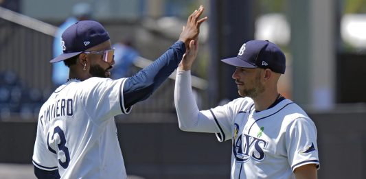 Tampa Bay Rays' Junior Caminero (13) and Brandon Lowe celebrate after the team defeated the Minnesota Twins during a baseball game Wednesday, May 28, 2025, in Tampa, Fla. (AP Photo/Chris O'Meara)