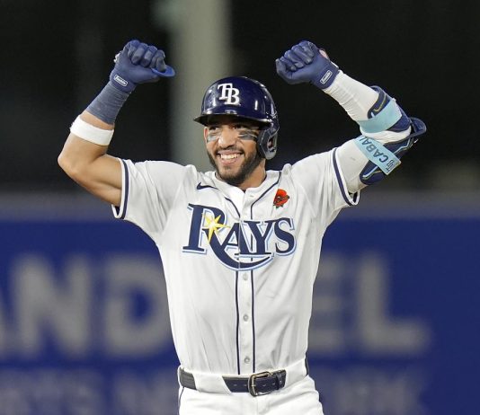 Tampa Bay Rays' José Caballero celebrates his two-run double off Minnesota Twins pitcher Kody Funderburk during the eighth inning of a baseball game Monday, May 26, 2025, in Tampa, Fla. (AP Photo/Chris O'Meara)