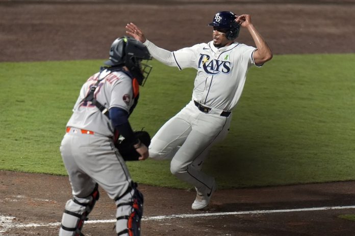 Rays defeat Astros 3-2 Tampa Bay Rays' Christopher Morel scores the game-winning run in front of Houston Astros catcher Victor Caratini on a sacrifice fly by Taylor Walls during the ninth inning of a baseball game Tuesday, May 20, 2025, in Tampa, Fla. (AP Photo/Chris O'Meara)
