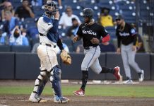 Miami Marlins' Otto Lopez scores in front of Tampa Bay Rays catcher Danny Jansen on an RBI single by Heriberto Hernandez off pitcher Garrett Cleavinger during the 10th inning of a baseball game Saturday, June 7, 2025, in Tampa, Fla. (AP Photo/Chris O'Meara)
