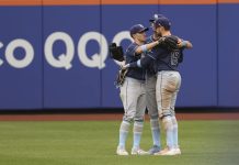 Tampa Bay Rays outfielders Jake Mangum, left, Kameron Misner, center, and Josh Lowe, right, react after defeating the New York Mets in a baseball game Sunday, June 15, 2025, in New York. (AP Photo/Pamela Smith)