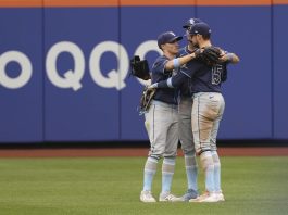 Tampa Bay Rays outfielders Jake Mangum, left, Kameron Misner, center, and Josh Lowe, right, react after defeating the New York Mets in a baseball game Sunday, June 15, 2025, in New York. (AP Photo/Pamela Smith)