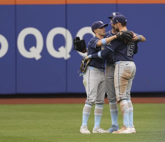 Tampa Bay Rays outfielders Jake Mangum, left, Kameron Misner, center, and Josh Lowe, right, react after defeating the New York Mets in a baseball game Sunday, June 15, 2025, in New York. (AP Photo/Pamela Smith)