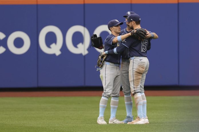 Rays Defeat Mets 9-0 Tampa Bay Rays outfielders Jake Mangum, left, Kameron Misner, center, and Josh Lowe, right, react after defeating the New York Mets in a baseball game Sunday, June 15, 2025, in New York. (AP Photo/Pamela Smith)