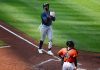 Tampa Bay Rays' Yandy Diaz, left, celebrates his three-run home run during the fourth inning of a baseball game as Baltimore Orioles catcher Chadwick Tromp looks on at right, Saturday, June 28, 2025, in Baltimore. (AP Photo/Nick Wass)